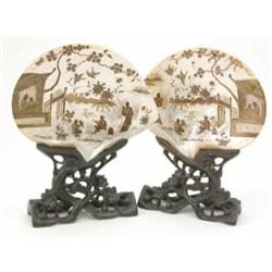 A pair of Japanese lacquered mother of pearl plaques, decorated with figures in gardens, 8ins, on...