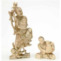 A Japanese carved ivory group of a fisherman, dragon and octopus, 5.75ins and a figure of a fishm...