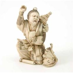 A Japanese carved ivory group of a man startled by a snake chasing a toad, signed, 4ins...