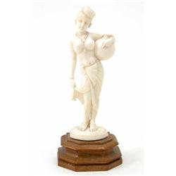 An Indian carved ivory figure of a girl water carrier 5.25ins...