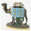 Image 1 : A George Jones 'Kumassie' majolica and black basalt camel, laden with two glazed, rope-bound bask...