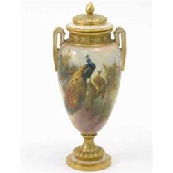 A Royal Worcester two-handled vase and cover, painted with peacocks and shrubs in bright enamels,...