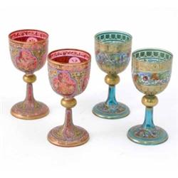 Two pairs of Bohemian enamelled goblets, one in pink glass, the other in green, enamelled with br...