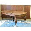 Image 1 : A large late Victorian mahogany extending dining table, with rounded ends and five extra leaves,...