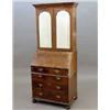 Image 1 : A George I design walnut bureau bookcase, with two mirrored doors, fitted interior and four short...