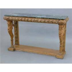 A 19th century carved pine console table, with green marble top and oak leaf frieze and back legs...
