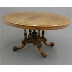 A Victorian figured walnut oval loo table, with string inlay and Tunbridgeware square panels on c...