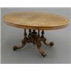 Image 1 : A Victorian figured walnut oval loo table, with string inlay and Tunbridgeware square panels on c...
