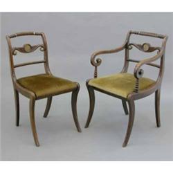 A set of six Regency simulated rosewood dining chairs, (including two with arms), with rope twist...