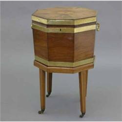 A George III mahogany and brass bound octagonal cellaret, with oval bat's wing medallion on separ...
