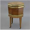 Image 1 : A George III mahogany and brass bound octagonal cellaret, with oval bat's wing medallion on separ...