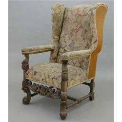 A late Victorian 17th century design wing back armchair, with 18th century floral tapestry back,...
