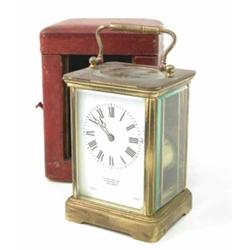A French brass carriage clock, with enamelled Roman dial, with travelling case, 5.5ins...