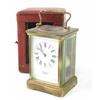 Image 1 : A French brass carriage clock, with enamelled Roman dial, with travelling case, 5.5ins...