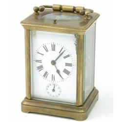 A French brass hour repeating carriage clock, with alarm and enamelled Roman dial, 4.75ins...