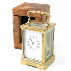 A French lacquered brass carriage clock, 5ins, with distressed travelling case...