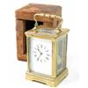 Image 1 : A French lacquered brass carriage clock, 5ins, with distressed travelling case...