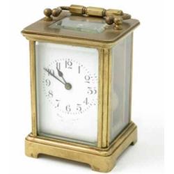 A French brass carriage clock, with enamelled dial, 5.5ins...