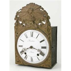 A 19th century French embossed brass wall clock, with enamelled Roman dial, signed Lamartinie a S...