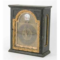 An 18th century Continental ebonised pine shelf clock, with arched brass Roman dial, enamelled pl...
