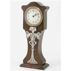 An Art Nouveau bird's eye mantel timepiece, with enamelled dial and silvered iris motif, 14.5ins...