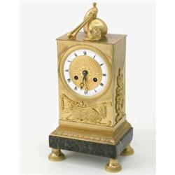 A Regence ormolu mantel clock, with rectangular case decorated with pastoral motifs of a lamb and...
