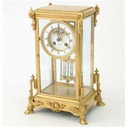 A French ormolu four glass mantel clock, with enamelled Roman dial, visible escapement and mercur...