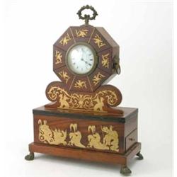 A 19th century French mahogany mantel timepiece, with brass inset Triton, griffin and eagle decor...