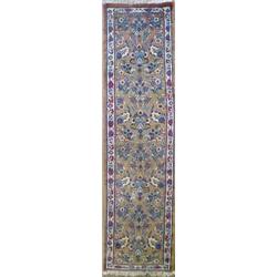 A modern Turkish fawn ground runner, all over woven with stylized floral bouquets, 11ft 2ins...