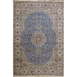 A Nain sky blue ground carpet, woven with circular petal rimmed medallion within a shaped oval fi...