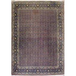A modern Persian red ground carpet, closely woven with all over lozenges and stylised foliage, 9f...