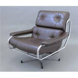 An early 1970's chrome and chocolate brown leather swivel armchair, and a matching armchair...