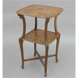 A French Art Nouveau floral marquetry two tier occasional table, in the style of Galle, the round...