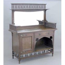 An Arts & Crafts oak mirror backed sideboard, with gallery surround, copper handles and hinges, a...