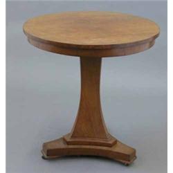 An early 19th century mahogany circular occasional table, on concave triangular stem and stepped...