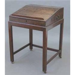 A George III mahogany clerk's desk, on separate chamfered leg base fitted brass castors, 1ft 1ins...