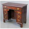 Image 1 : A George III design mahogany kneehole desk, with recessed cupboard and nine drawers on bracket fe...