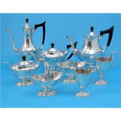 An American silver eight piece tea and coffee set, of Adam design with ebony knops and handles an...