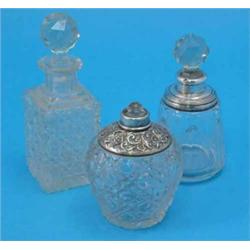 A George V Art Deco cut glass scent bottle and stopper, with silver collar, London 1934, an Edwar...