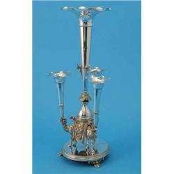 A Victorian plated centrepiece, cast in the form of three conjoined camels supporting four trumpe...