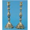 Image 1 : A pair of George V cast silver candlesticks, with multi-baluster stems and decorated with moulded...