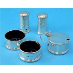 A George VI five piece silver condiment set, comprising pair of salts, pair of pepperettes and dr...