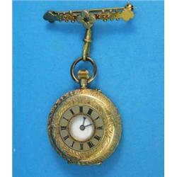 An 18k half hunter fob watch on a 9ct gold and sapphire suspension brooch....