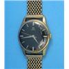 Image 1 : A gentleman's 9ct gold Omega wrist watch with black dial and flexible bracelet....