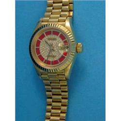 A lady's 18k gold Rolex Datejust wrist watch, with original pave diamond and coral set dial...