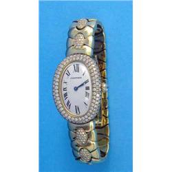 A lady's 18k gold Cartier Baignoire wrist watch with oval Roman dial, diamond set bezel and brace...