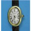 Image 1 : A lady's 18k gold Cartier wrist watch with oval Roman dial and Jaeger Le Coultre movement....