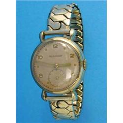 A gentlemans 9ct gold Jaeger Le Coultre wrist watch, with champagne dial and Dennison case...