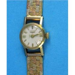 A lady's 9ct gold Longines wrist watch, with three colour textured bracelet...