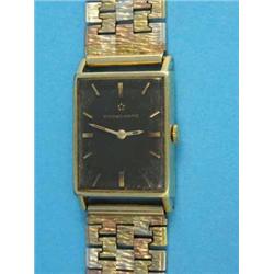 A gentleman's 18k gold Eterna-Matic wrist watch, with black dial and 9ct gold three colour textur...